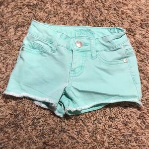 Teal shorts with stringy bottom